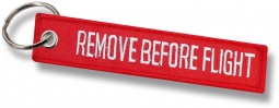 Tekstilni obesek - Remove Before Flight rdeč